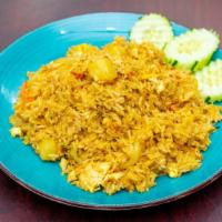 Pineapple Fried Rice · Pineapple fried rice with choice of meat, yellow curry powder, cashew nuts, carrot, egg, oni...