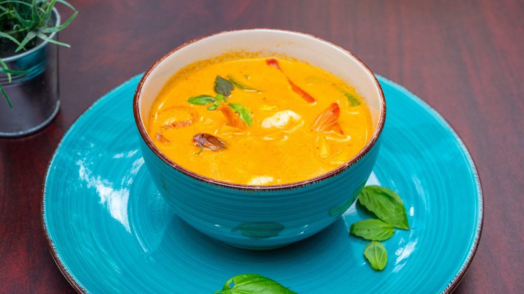 Red Curry · Thai style coconut milk red curry with bamboo shoot, basil leave and bell pepper.