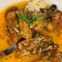 Galinha Ao Alho · chicken in garlic sauce on the bone
half chicken