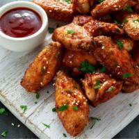 Bbq Wings · Three pieces of crispy BBQ Chicken wings.