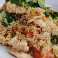 Basil Fried Rice · Spicy fried rice with eggs, bell pepper, chili onion and fresh basil.