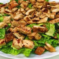 Large Chicken Caesar Salad · A traditional Caesar salad topped with charbroiled chicken breast and store baked croutons s...