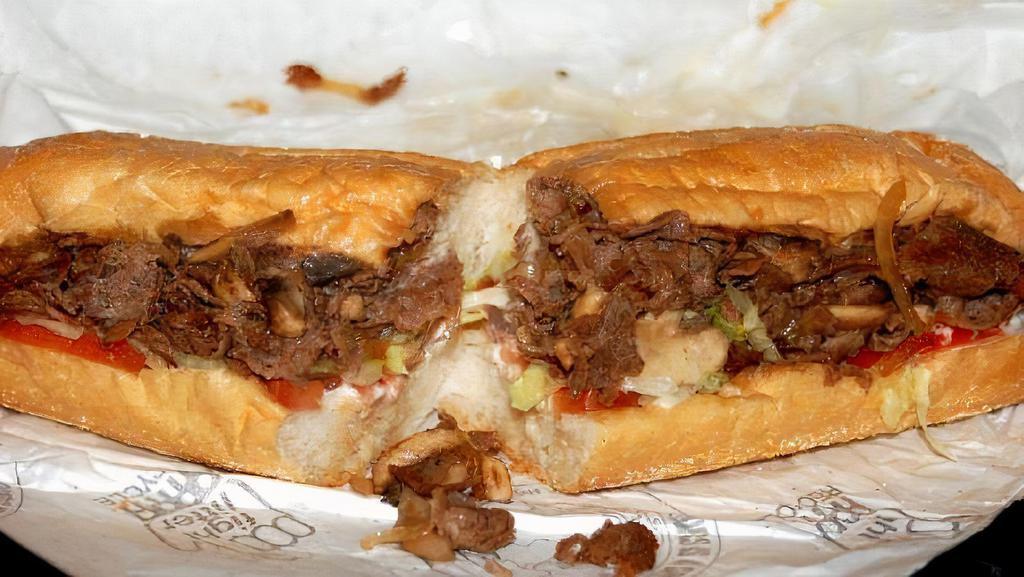 Jersey Cheese Steak · Genuine grilled steak, onions and melted provolone served on a hero.