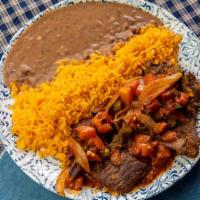 Bistec A La Mexicana Platter · Mexican style beef stew. Served with rice and beans.