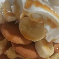 The Simmy · Our signature tasty Waffle topped with bananas, caramel sauce, and whipped cream.
