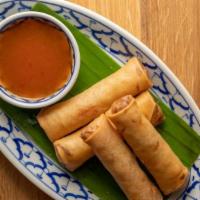 Vegetable Spring Roll · Carrots, cabbage, corn, vermicelli noodles, and pineapple sweet chili sauce.
