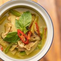 Green Curry · Gluten free. 
Eggplant bamboo shoots, bell peppers, basil, and coconut milk. Served with jas...