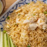 Crab Meat Fired Rice · Crab meat, rice, egg, scallion, cilantro, cucumbers, and seafood sauce.