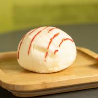 White Chocolate Parisianne Truffle · White chocolate ice cream with raspberry sorbet center enrobed in white chocolate with red d...