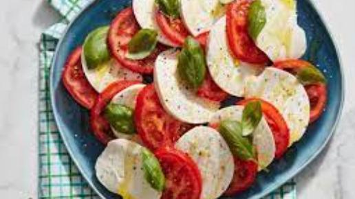 Caprese Salad · Fresh mozzarella, tomatoes, and basil with balsamic vinaigrette and olive oil.