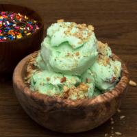 Pistachio Almond Ice Cream  · Comes with a 9oz cup of pistachio almond ice cream. Additional Toppings Sold separately.