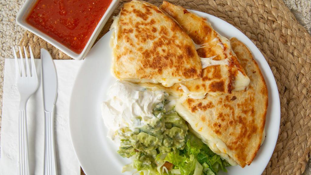 Cheese Quesadillas · Flour tortilla melted Mexican cheese, sour cream, tampiqueña sauce, and guacamole. Served with rice and refried beans.