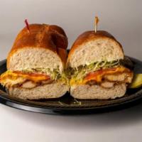 Breaded Chicken Cutlet Sandwich · Breaded Chicken Cutlet 1/2 sub with Yellow American Cheese, Lettuce, Tomato, & Mayo