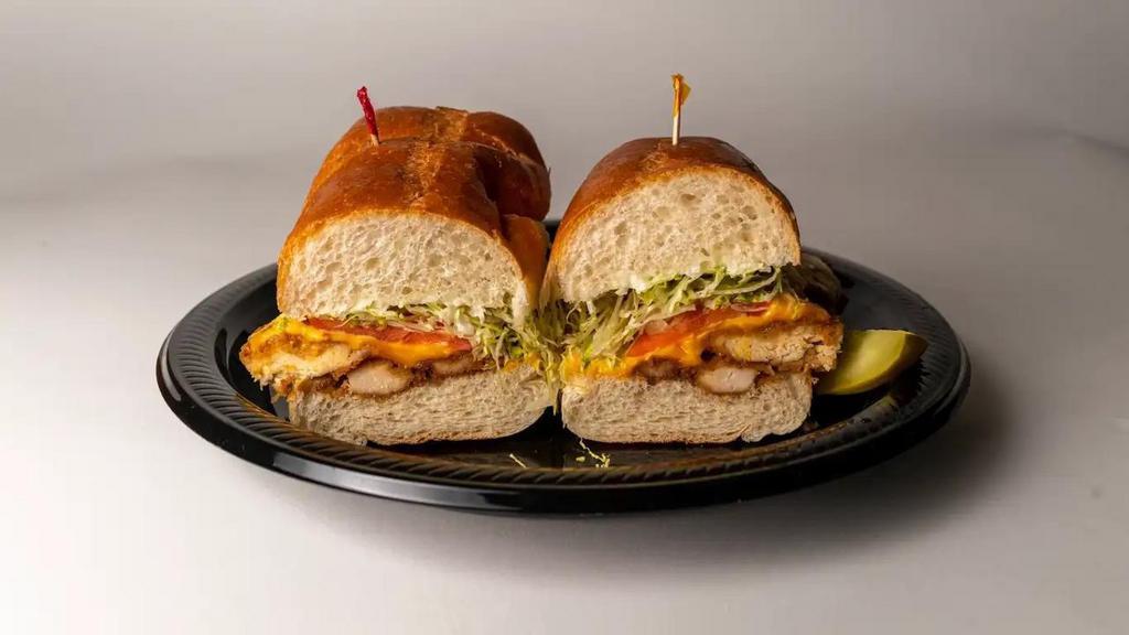 Breaded Chicken Cutlet Sandwich · Breaded Chicken Cutlet 1/2 sub with Yellow American Cheese, Lettuce, Tomato, & Mayo