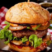 Bbq Ranch Bacon Burger · Thick, juicy burger loaded with cheddar cheese, beef bacon, crispy onions, BBQ and ranch sau...