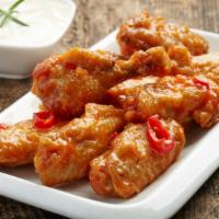 Thai Chili Wings · Golden, crispy wings glazed with sweet and spicy Thai Chili sauce.