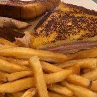 Monte Cristo · French toast, turkey, ham, Swiss cheese and French fries.