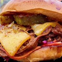 Smoked Brisket Burger + Fries · Overnight smoked brisket piled with applewood smoked bacon, crispy fried onions, and voodoo ...