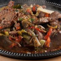 Sizzling Mongolian Beef · Tender USDA choice flank steak stir fried with roasted peppers, garlic, ginger, and scallion...