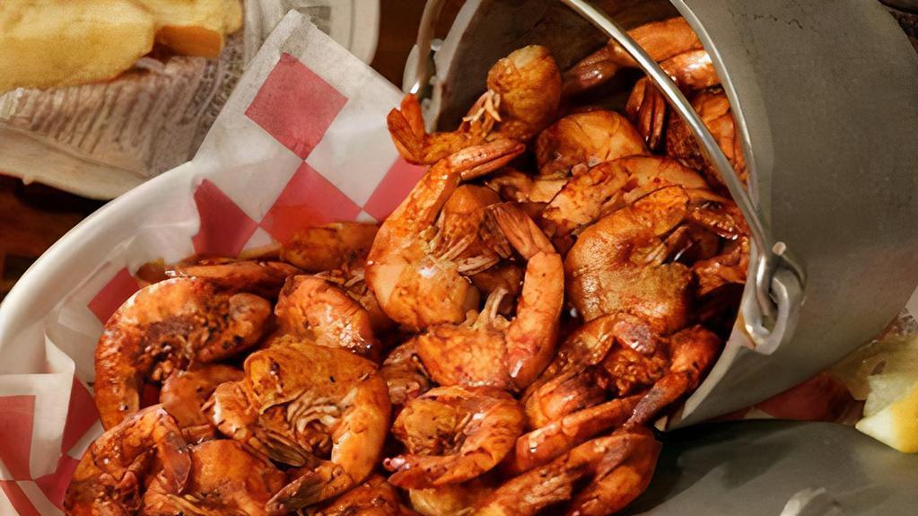 Shrimp By The Pound · Available EZ peel or shell off, shaken in our homemade nine-spiced garlic butter and served with corn, red potatoes.