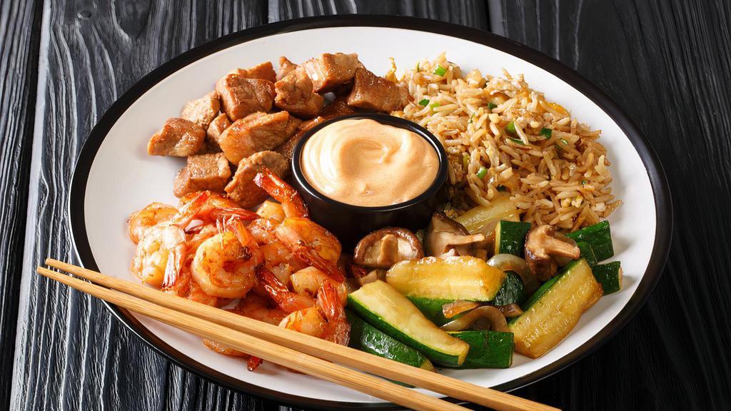 Hibachi Chicken & Shrimp Dinner · Chicken and shrimp combination. Full dinner portion fresh made to order, teppanyaki sauteed in a sweet and savory homemade teriyaki sauce. Served with seasonal vegetables, on top of jasmine rice or fried rice