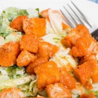 Buffalo Chicken Salad · Fresh garden salad prepared with chicken that has been cooked in a spicy buttery sauce. Serv...