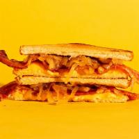 Bacon Grilled Cheese · Melted american and cheddar cheese, crispy bacon, and caramelized onions on buttery toasted ...