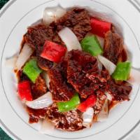 Pepper Steak With Onion / 青椒牛 · Served with white rice.