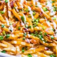 Bacon Loaded Fries · Our crispy French fries piled high, topped with bacon and shredded cheese. Served with ranch...