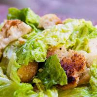 Chicken Caesar Salad · Romaine lettuce tossed in a creamy Caesar dressing, topped with grilled chicken, croutons an...