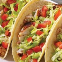 Fish Tacos  · Blackened catch of the day wrapped in 
flour tortillas and layered with bacon aioli, 
shredd...