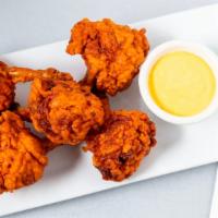 Chicken Lollipop · Spicy. Chicken wings marinated in fresh herbs and spices. Five wings.