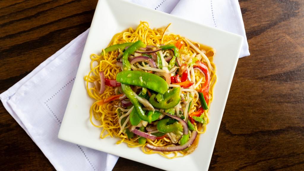 Vegetable Cantonese Noodle · Mixed veggies and sauce over pan fried noodle.