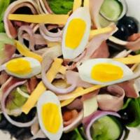 Chef Salad · Ham, salami, provolone, and American cheese, boiled egg over garden salad.