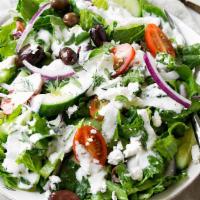 Greek Salad · Feta cheese over garden salad.