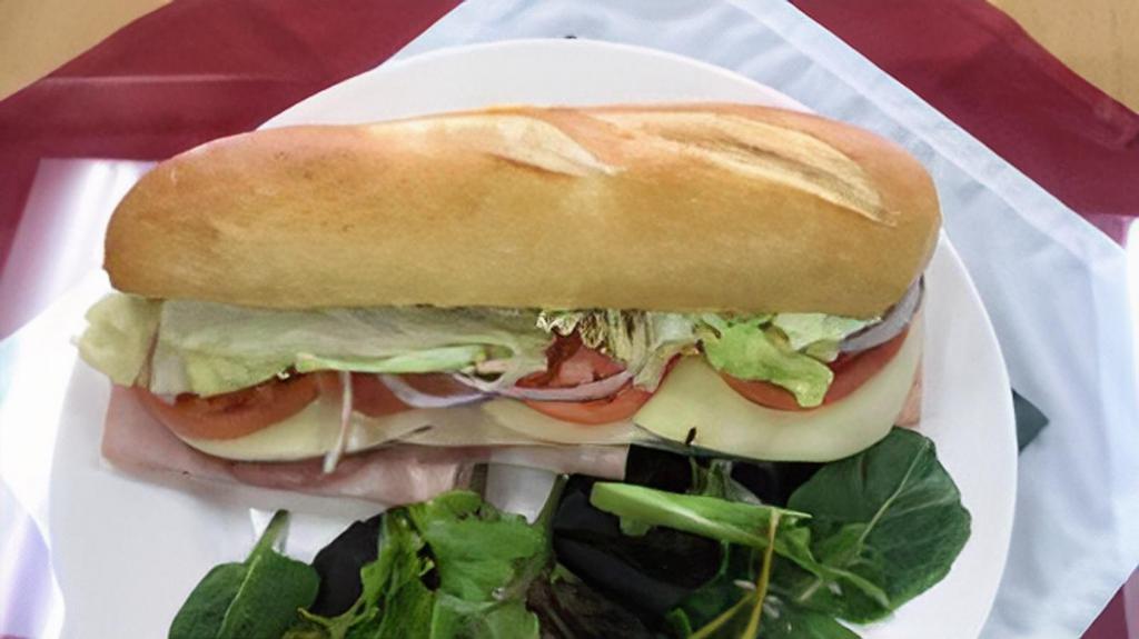 Italian Sub · Ham, salami, and provolone cheese. Comes with lettuce, onions, tomato, olive oil and vinegar and oil.