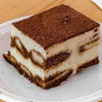 Tiramisu · Layers of espresso drenched sponge cake divided by mascarpone cream, dusted with cocoa powder.