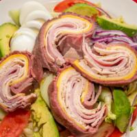 Chef Salad · Sliced roast beef, turkey, ham, American and swiss cheese, lettuce, tomatoes, cucumbers, sli...