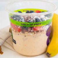 Banana Bowl · Blended banana almond butter topped with granola, fresh blueberries, strawberries plus cocon...