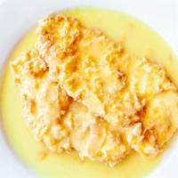 Chicken Francese · Tender pieces of chicken dipped in egg batter in lemon wine butter sauce.