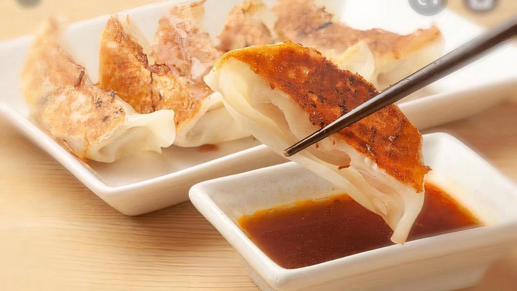 Gyoza Appetizer · Six pieces. Choose chicken or veggie with dumpling sauce.