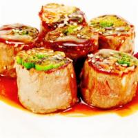 Beef Negimaki · Thin sliced steak wrap with green onion and teriyaki sauce.