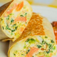 Veggie Breakfast Burrito · Scrambled eggs, grilled tomato, grilled mushrooms, grilled onions, home fries, and swiss che...