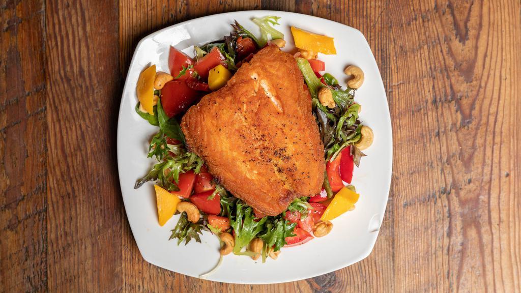 Salmon Salad · Gluten-free. Five ounce sauteed salmon over mixed greens, mangoes, red bell peppers, grilled acorn squash, cashews.