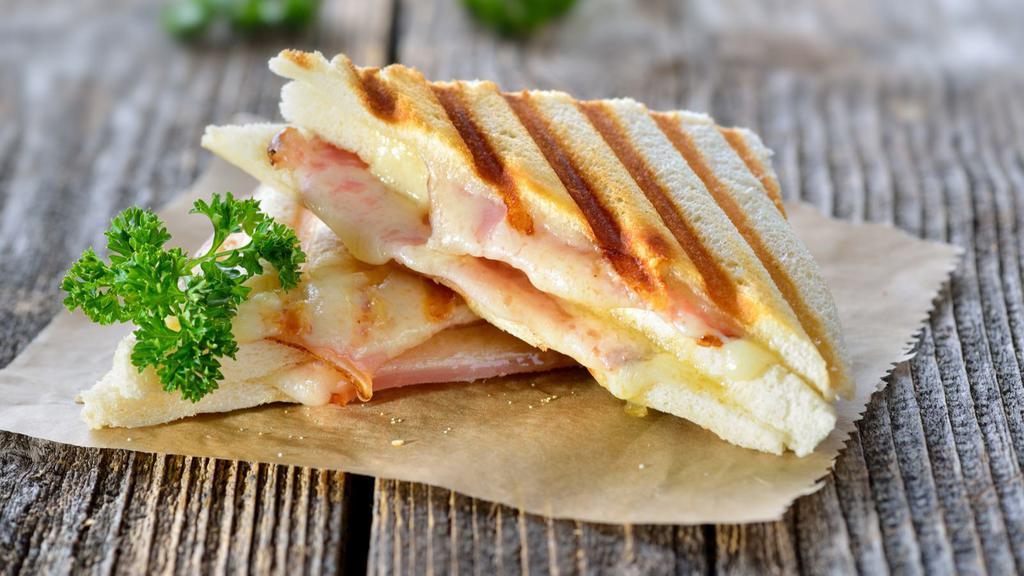Grilled Cheese With Ham · Toasted bread with melted cheese and ham.