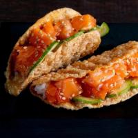 Salmon Taco · Salmon, Miso Vinegar, Cucumber, Sushi Rice and Sesame Seeds in a Gyoza Shell. Order comes wi...