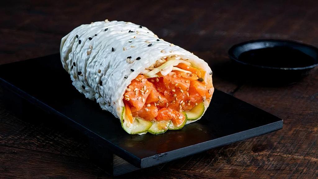 Salmon Sushirrito · Salmon, Yuzu Coleslaw, Cucumber, Sesame Seeds, Sushi Rice and Miso Vinegar Wrapped in Soy Paper.