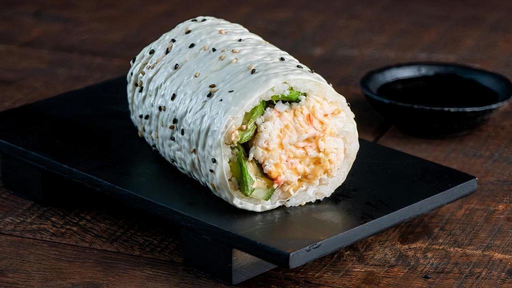 Kanikama Sushirrito · Kanikama, Kewpie Mayo, Avocado, Cucumber, Sushi Rice and Ponzu Mayo Wrapped in Soy Paper.