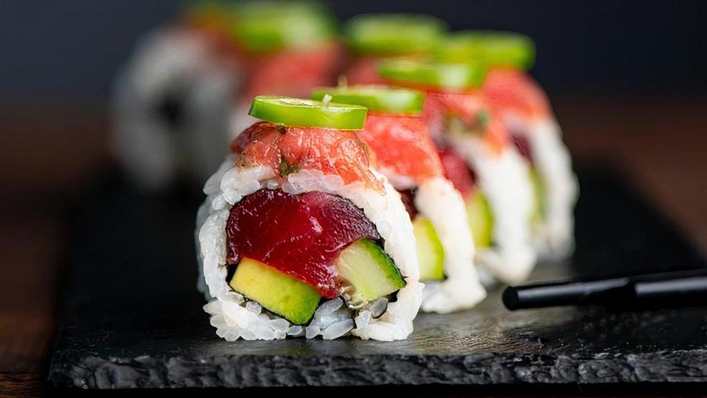 Double Tuna Roll · Tuna, Avocado, Cucumber, White Sesame Seeds, Sushi Rice, Nori, topped with Spicy Tuna and Serrano.