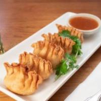Crab Rangoon · Crab meat, Italian cream cheese, Asian spices wrapped with house skin and served with sweet ...